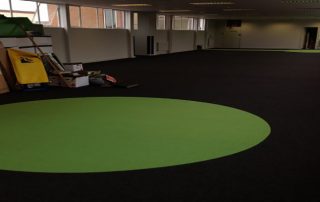 school hall with green carpet spot