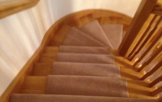 domestic carpet running down stairs