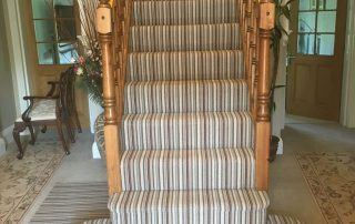 striped carpet on stairs