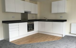 kitchen with carpet and vinyl floor