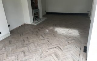 grey karndean flooring in front of fireplace